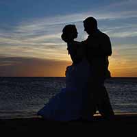 Bride and groom in the sunset.