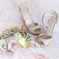 Wedding shoes on lace cloth.