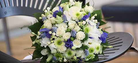 Bridal boquet on chair.